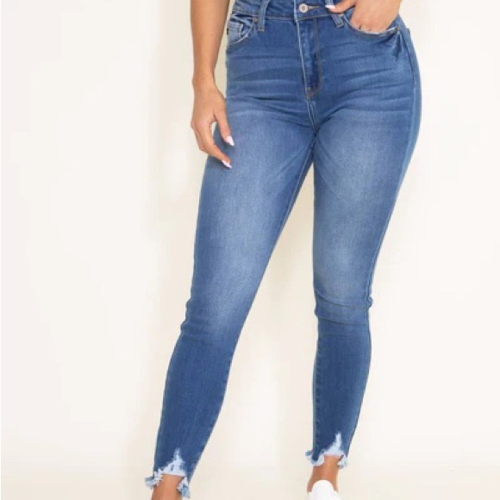fashionable retro vintage style frayed dark Jeans